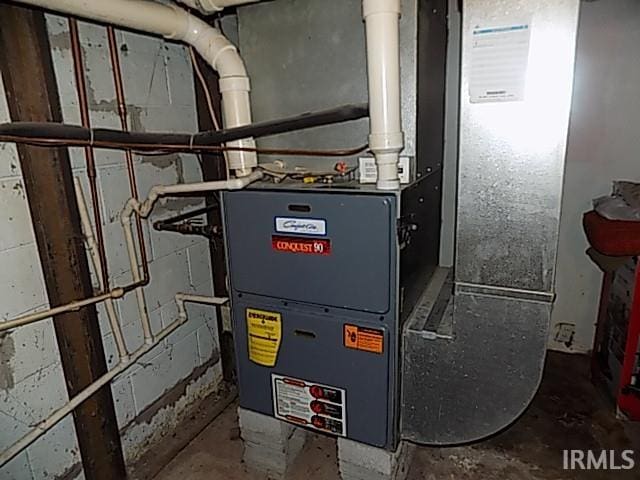 utility room with heating unit