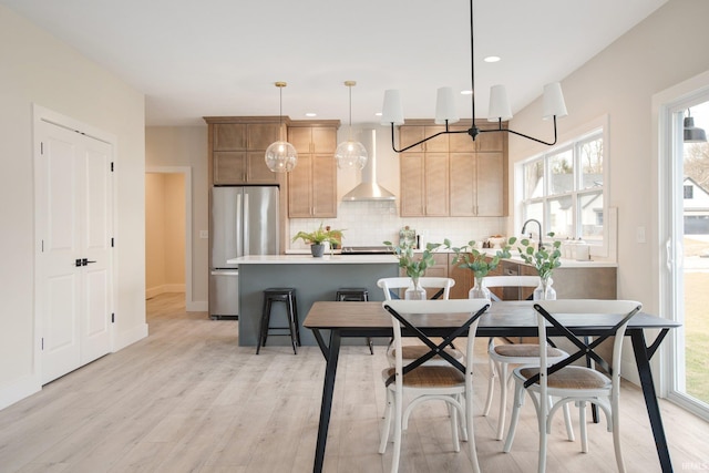 dining area with light hardwood / wood-style floors