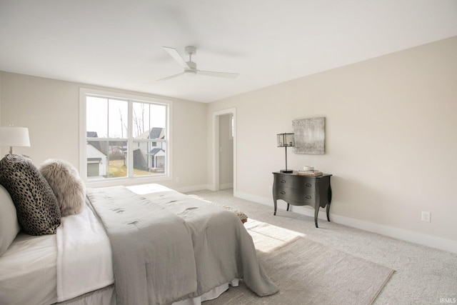 bedroom with light carpet and ceiling fan