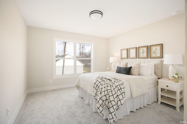 bedroom with light carpet