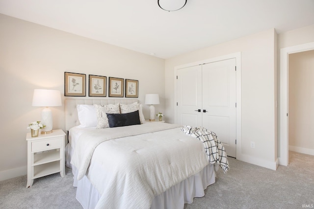 carpeted bedroom featuring a closet