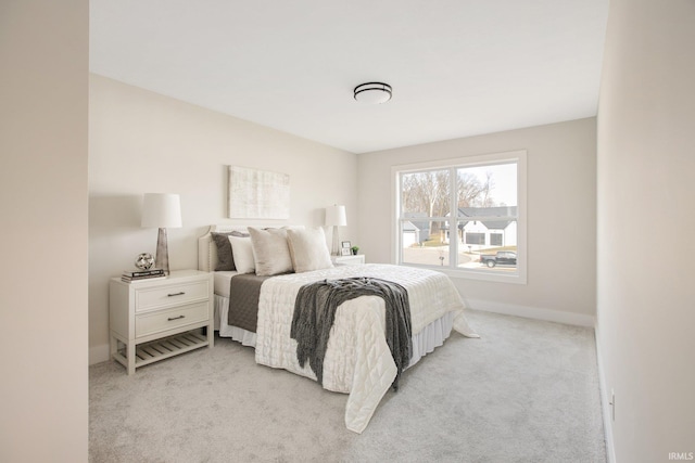 bedroom with light carpet