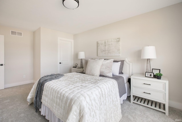 bedroom with light carpet