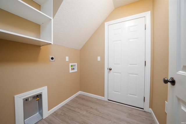 washroom with light hardwood / wood-style floors, washer hookup, and electric dryer hookup