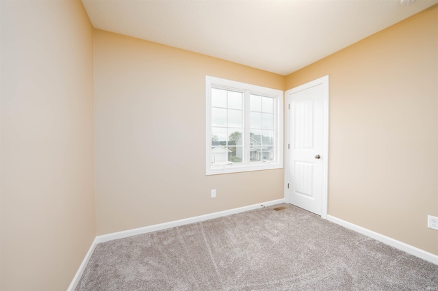 unfurnished room with carpet