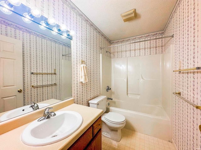 full bathroom featuring bathing tub / shower combination, a textured ceiling, toilet, vanity, and tile patterned flooring