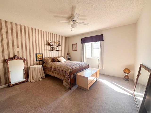 carpeted bedroom featuring a textured ceiling and ceiling fan