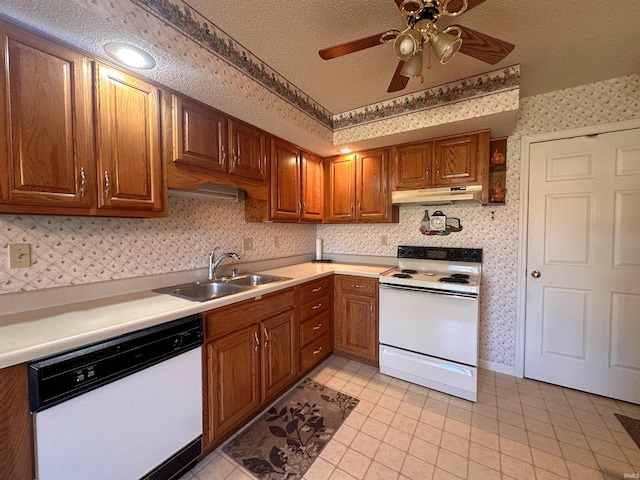 kitchen featuring ceiling fan, light tile patterned floors, a textured ceiling, sink, and white appliances