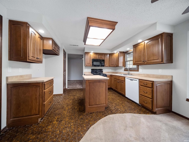 kitchen with a center island, a textured ceiling, black appliances, and dark carpet