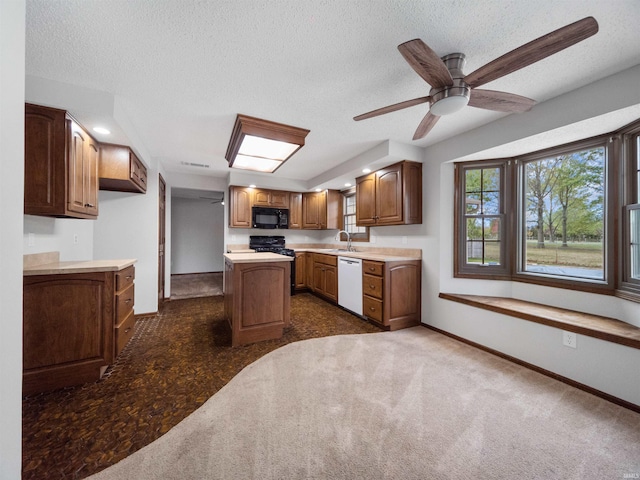 kitchen with dishwasher, a textured ceiling, a center island, ceiling fan, and dark carpet