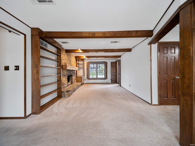 unfurnished living room with light carpet and a textured ceiling