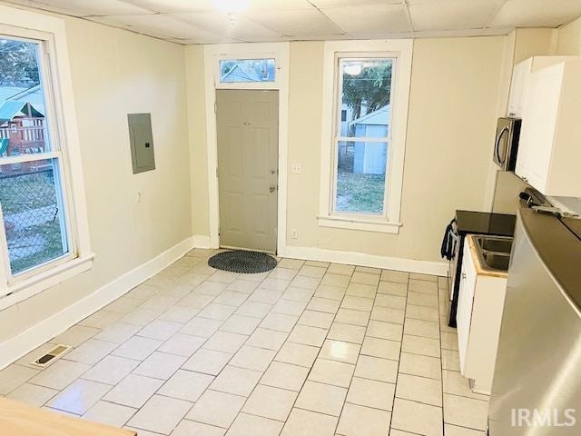 interior space featuring a healthy amount of sunlight and light tile patterned flooring