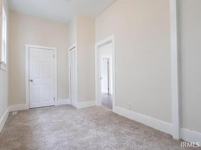 unfurnished bedroom with light carpet