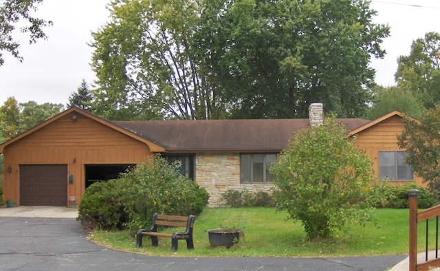 view of front facade with a front lawn and a garage