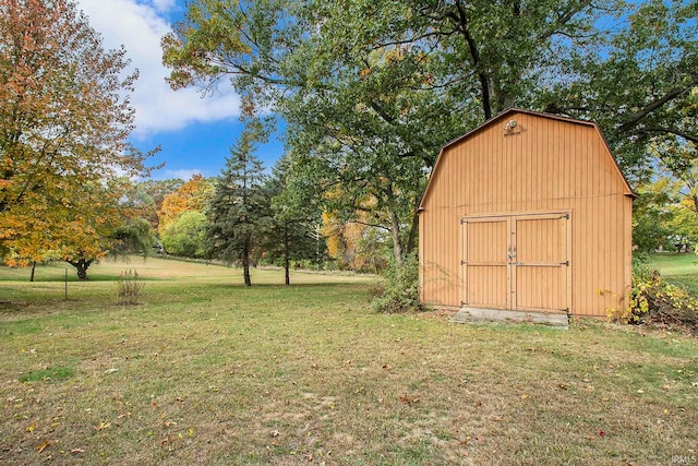 view of outbuilding with a yard