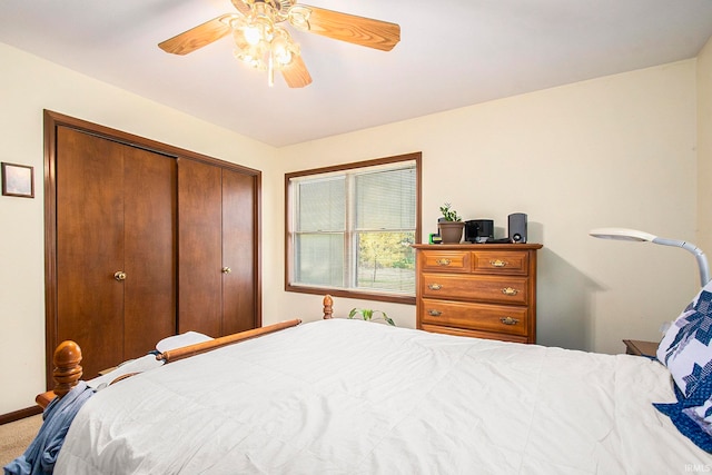 bedroom with a closet, ceiling fan, and carpet