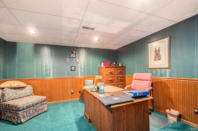 office area with a paneled ceiling and dark carpet