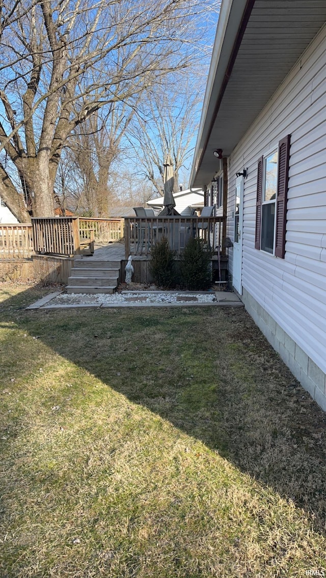 view of yard featuring a wooden deck