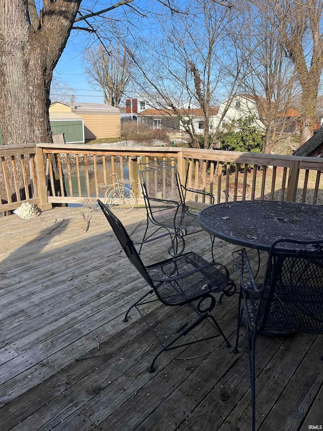 deck featuring a shed