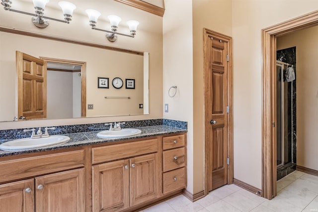 bathroom with vanity and tile patterned flooring