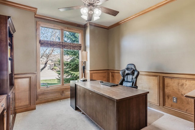 office space featuring light carpet, crown molding, and ceiling fan