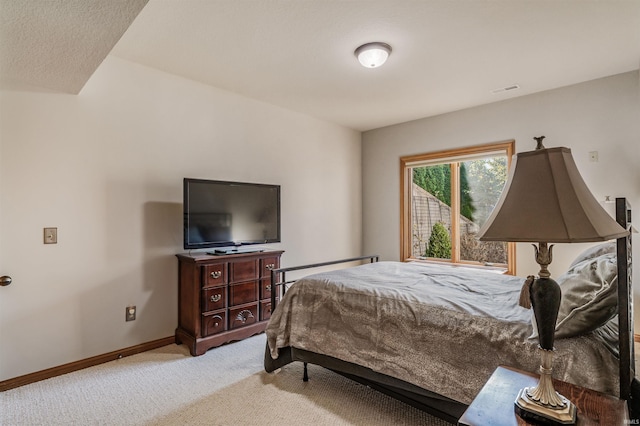 bedroom featuring light colored carpet