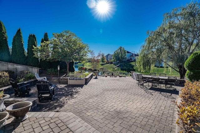 view of patio with a fire pit