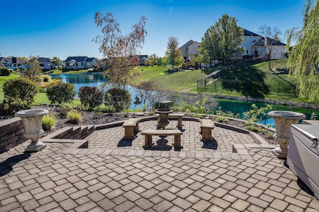 view of patio featuring a water view