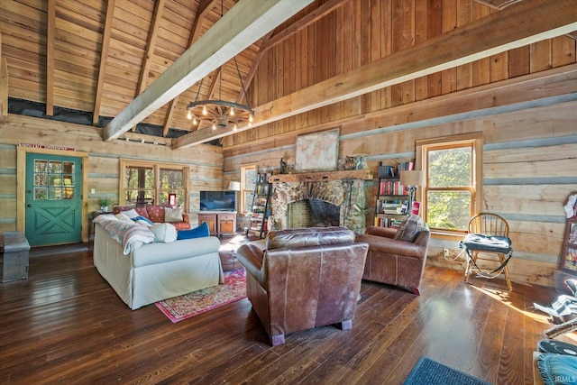 living room with a stone fireplace, dark hardwood / wood-style flooring, wooden walls, high vaulted ceiling, and an inviting chandelier