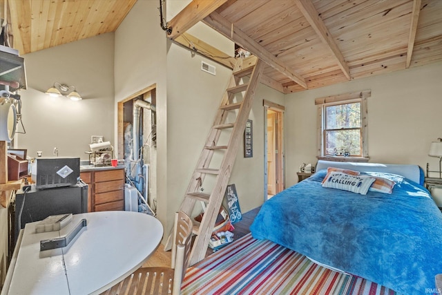 bedroom featuring wood ceiling, vaulted ceiling with beams, and hardwood / wood-style floors