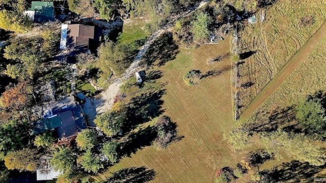 birds eye view of property with a rural view