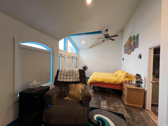 bedroom featuring dark wood-type flooring, ceiling fan, and high vaulted ceiling