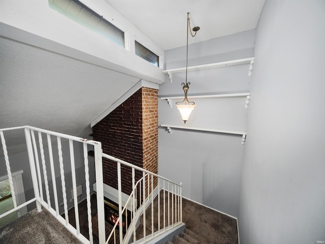 stairway featuring carpet floors and plenty of natural light