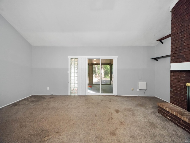 unfurnished living room with a brick fireplace and carpet floors