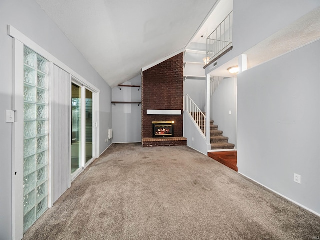 unfurnished living room with carpet, lofted ceiling, and a fireplace