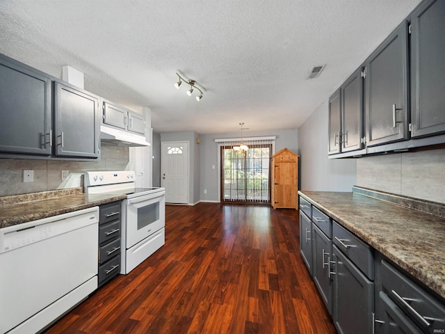 kitchen with white appliances, a chandelier, dark hardwood / wood-style floors, and gray cabinets