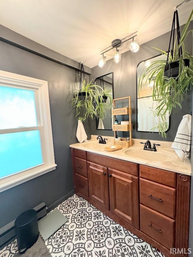 3810 E 100 N, Flora, IN 46929 - full bathroom featuring tile patterned flooring, double vanity, and a sink