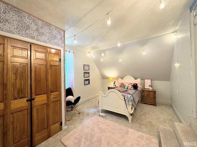 3810 E 100 N, Flora, IN 46929 - bedroom with light carpet, a textured ceiling, baseboards, and track lighting