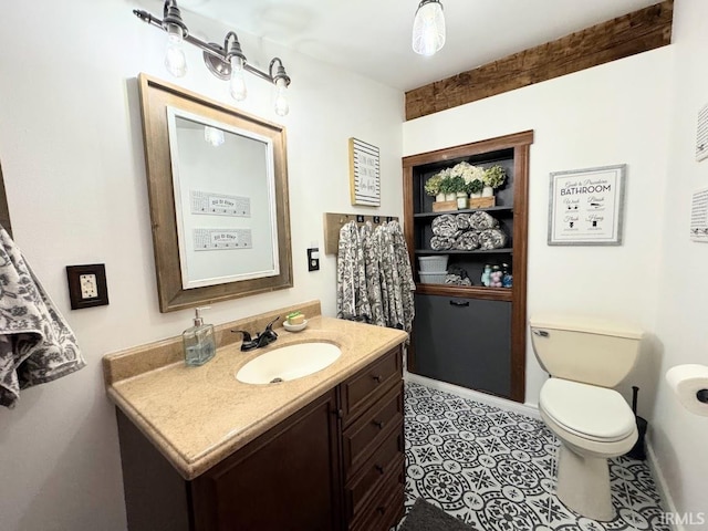 3810 E 100 N, Flora, IN 46929 - half bathroom featuring toilet, baseboards, and vanity