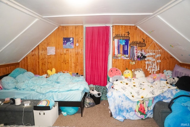 carpeted bedroom with wooden walls and vaulted ceiling