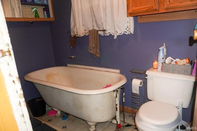 bathroom featuring a bath and toilet