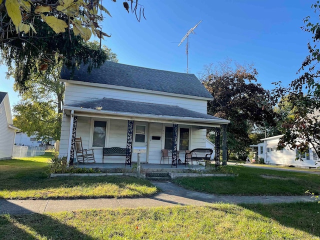 view of front of home with a front lawn and covered porch