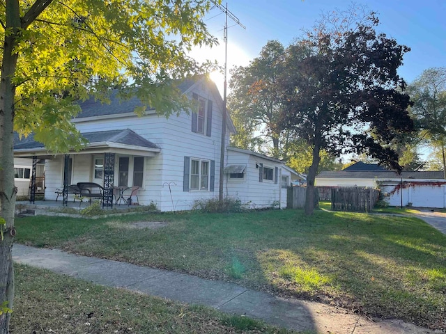 view of front of house with a front yard and a patio