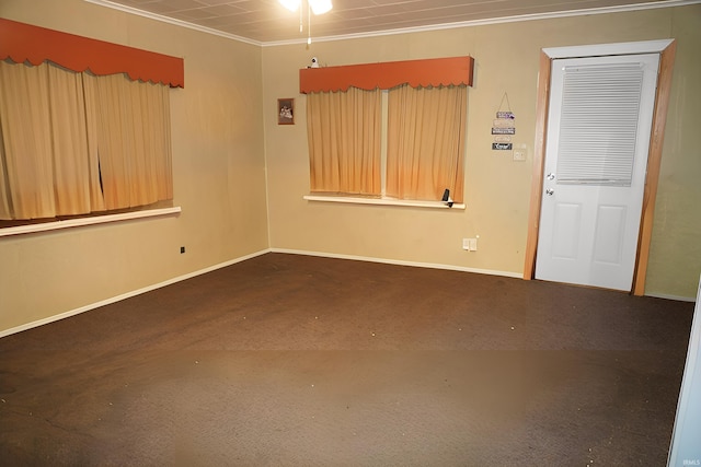 spare room featuring ornamental molding and ceiling fan