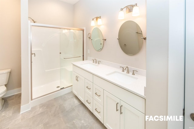 bathroom featuring a shower with door, toilet, and vanity