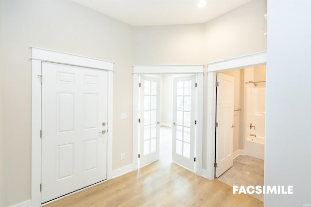 foyer with light hardwood / wood-style floors