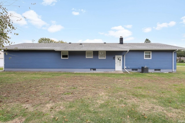 back of house featuring a yard