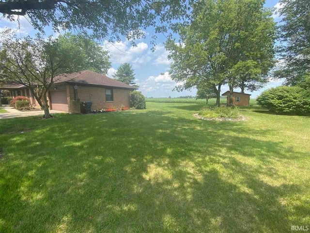 view of yard featuring a garage