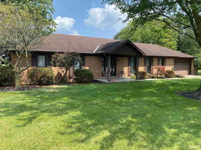 ranch-style house with a front yard and a garage