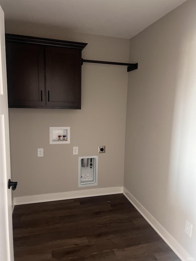 laundry area featuring baseboards, dark wood-type flooring, hookup for an electric dryer, cabinet space, and washer hookup